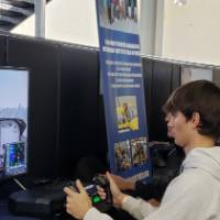 Student at Flight Simulator at Exhibition Hall